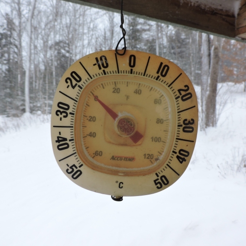 Thermometer showing -18C in snow